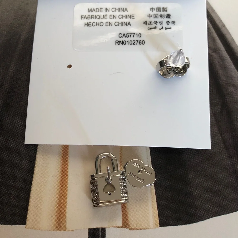 Authentic New on card Kate spade silver crystal lock earrings